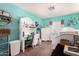 Bright bedroom with blue walls, a white bed, desk, and dresser at 3256 W Libby St, Phoenix, AZ 85053