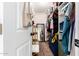 Walk-in closet featuring ample storage, shelving, and a full-length mirror at 3256 W Libby St, Phoenix, AZ 85053