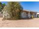 Side view of a single-story home with desert landscaping, highlighting its simple charm and serene environment at 3256 W Libby St, Phoenix, AZ 85053
