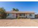 Charming single-story home with desert landscaping, featuring a cozy front entrance and ample natural light at 3256 W Libby St, Phoenix, AZ 85053