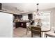 Cozy kitchen featuring dark cabinets, stainless appliances and a connected dining area at 3256 W Libby St, Phoenix, AZ 85053
