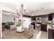 Bright kitchen with stainless appliances and tile flooring, adjacent to the living room for an open feel at 3256 W Libby St, Phoenix, AZ 85053