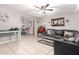 A cozy living room with tile flooring, stylish decor, and an open view to the dining area, great for entertaining at 3256 W Libby St, Phoenix, AZ 85053