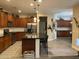 Modern kitchen boasts sleek black countertops, stainless steel appliances, and a large central island at 3845 E Yeager Dr, Gilbert, AZ 85295