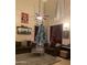 Inviting living room with neutral tones, a cozy seating area, and a beautifully decorated Christmas tree at 3845 E Yeager Dr, Gilbert, AZ 85295