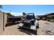 Backyard with a truck cab on a trailer, offering ample space for hobbies and projects at 3848 W Kings Ave, Phoenix, AZ 85053