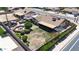 Expansive backyard with lush landscaping, a patio, and a detached two-car garage at 3848 W Kings Ave, Phoenix, AZ 85053