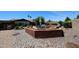 Charming backyard with a raised patio, perfect for outdoor dining and entertaining at 3848 W Kings Ave, Phoenix, AZ 85053