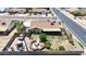 Spacious backyard with a dining patio, garden area, and detached two-car garage at 3848 W Kings Ave, Phoenix, AZ 85053