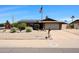 Charming single-story home featuring solar panels, desert landscaping, and a two-car garage at 3848 W Kings Ave, Phoenix, AZ 85053