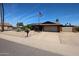 Inviting single-story house boasts desert landscaping, solar panels, and a convenient two-car garage at 3848 W Kings Ave, Phoenix, AZ 85053