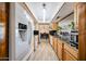 Modern kitchen boasts sleek appliances, ample counter space, and natural wood cabinets at 3848 W Kings Ave, Phoenix, AZ 85053