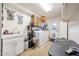 Functional laundry area with washer, dryer, sink, storage, and convenient access to the exterior at 3848 W Kings Ave, Phoenix, AZ 85053