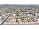 A high aerial view of a sprawling residential neighborhood with diverse homes, pools, and mature landscaping at 3848 W Kings Ave, Phoenix, AZ 85053