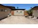 Rustic side gate with desert-themed decorations, adding a touch of southwest charm at 3848 W Kings Ave, Phoenix, AZ 85053