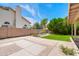 View of the backyard featuring a well-maintained lawn and hardscaped patio area at 3921 W Jasper Dr, Chandler, AZ 85226