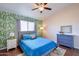 Bright bedroom featuring hardwood floors, a ceiling fan, and nice decor at 3921 W Jasper Dr, Chandler, AZ 85226
