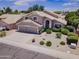 Exterior shot showcasing a well-maintained home with a lush, landscaped front yard at 3921 W Jasper Dr, Chandler, AZ 85226