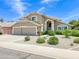 Charming two-story home featuring a three car garage, desert landscaping, and a neutral color scheme at 3921 W Jasper Dr, Chandler, AZ 85226
