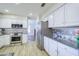 Modern kitchen featuring stainless steel appliances and granite countertops at 3921 W Jasper Dr, Chandler, AZ 85226