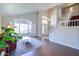 Bright and airy living room with hardwood floors, large windows, and view into entry at 3921 W Jasper Dr, Chandler, AZ 85226