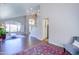 Bright living room featuring hardwood floors, chandelier, large windows, and staircase at 3921 W Jasper Dr, Chandler, AZ 85226