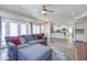 Open-concept living room with hardwood floors, a comfortable seating area, and view into kitchen at 3921 W Jasper Dr, Chandler, AZ 85226