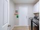 Mud room features front-loading washer/dryer and a door to the outside at 3921 W Jasper Dr, Chandler, AZ 85226