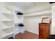 Walk-in closet with organizers, shelves, drawers, hanging rods, and hardwood floors at 3921 W Jasper Dr, Chandler, AZ 85226