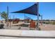 Destiny Park featuring a playground and shaded seating areas, perfect for Gathering outings at 39985 W Sparks Ln, Maricopa, AZ 85138
