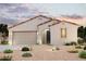Charming single-story home with desert landscaping and a two-car garage, perfect for modern living at 39985 W Sparks Ln, Maricopa, AZ 85138
