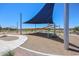 Modern community playground with shade structures and play equipment for active fun at 39985 W Sparks Ln, Maricopa, AZ 85138