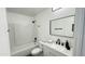 Clean bathroom with a shower-tub combo, new vanity with sink, and modern fixtures at 4125 W Villa Rita Dr, Glendale, AZ 85308