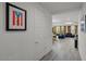 Hallway with a modern artwork, with an open view into the living space with curtains and furniture at 435 E Shellie Ct, Casa Grande, AZ 85122