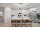 Modern kitchen with white cabinets, stainless steel appliances, and a large island with seating at 435 E Shellie Ct, Casa Grande, AZ 85122