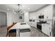 Modern kitchen with white cabinets, stainless steel appliances, and a large island with seating at 435 E Shellie Ct, Casa Grande, AZ 85122