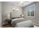Bedroom staged with bed, side tables, lamps, window and decor items at 4401 N 24Th Pl, Phoenix, AZ 85016