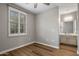 This bedroom features wood floors, plantation shutters, and an attached vanity at 4401 N 24Th Pl, Phoenix, AZ 85016