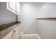 Pantry area with granite counters and upper and lower white cabinets at 4401 N 24Th Pl, Phoenix, AZ 85016