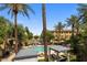 Stunning pool area surrounded by palm trees and cabanas, offering a luxurious outdoor living space at 4401 N 24Th Pl, Phoenix, AZ 85016