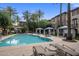 Inviting community pool with lounge chairs and shaded cabanas, perfect for enjoying the outdoors at 4401 N 24Th Pl, Phoenix, AZ 85016
