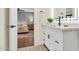 Stylish bathroom featuring modern vanity and fixtures, with a view into the beautiful bedroom at 4910 E Shaw Butte Dr, Scottsdale, AZ 85254