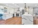 Updated kitchen with stone countertops, white cabinets, island with bar, and stainless steel appliances at 4910 E Shaw Butte Dr, Scottsdale, AZ 85254