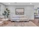 Cozy living room featuring a modern sofa, accent chairs, artwork, and stylish decor at 4910 E Shaw Butte Dr, Scottsdale, AZ 85254