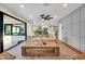 Beautiful living room with stone counters, hardwood floors and access to the kitchen and dining areas at 4910 E Shaw Butte Dr, Scottsdale, AZ 85254