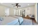 Spacious primary bedroom with adjoining bath and bonus sitting room features calming colors and bright natural light at 4910 E Shaw Butte Dr, Scottsdale, AZ 85254