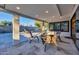 Outdoor living space featuring covered patio, woven furniture, and a sparkling pool, perfect for entertaining at 4910 E Shaw Butte Dr, Scottsdale, AZ 85254