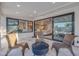 Outdoor patio with woven chairs and clear views of the indoor living area, enhancing the sense of indoor-outdoor living at 4910 E Shaw Butte Dr, Scottsdale, AZ 85254