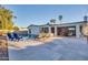 Charming backyard featuring a sparkling pool, patio area, and well-maintained desert landscaping at 4910 E Shaw Butte Dr, Scottsdale, AZ 85254