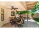 Cozy covered patio with a ceiling fan and an outdoor dining area; perfect for relaxing and entertaining at 5132 E Grandview Rd, Scottsdale, AZ 85254